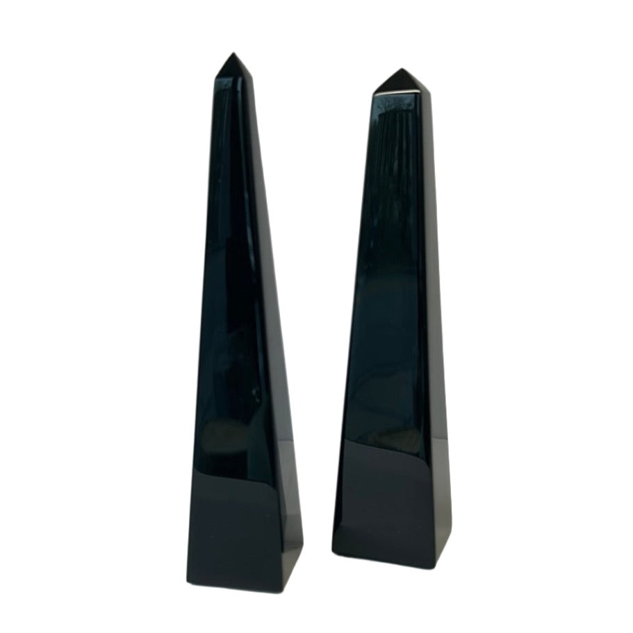 Black obsidian obelisks, known for protection from negativity and enhancing clarity and self-discovery.