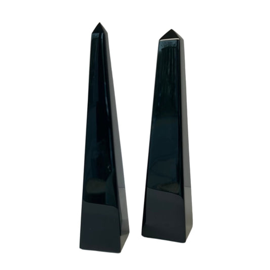 Black obsidian obelisks, known for protection from negativity and enhancing clarity and self-discovery.
