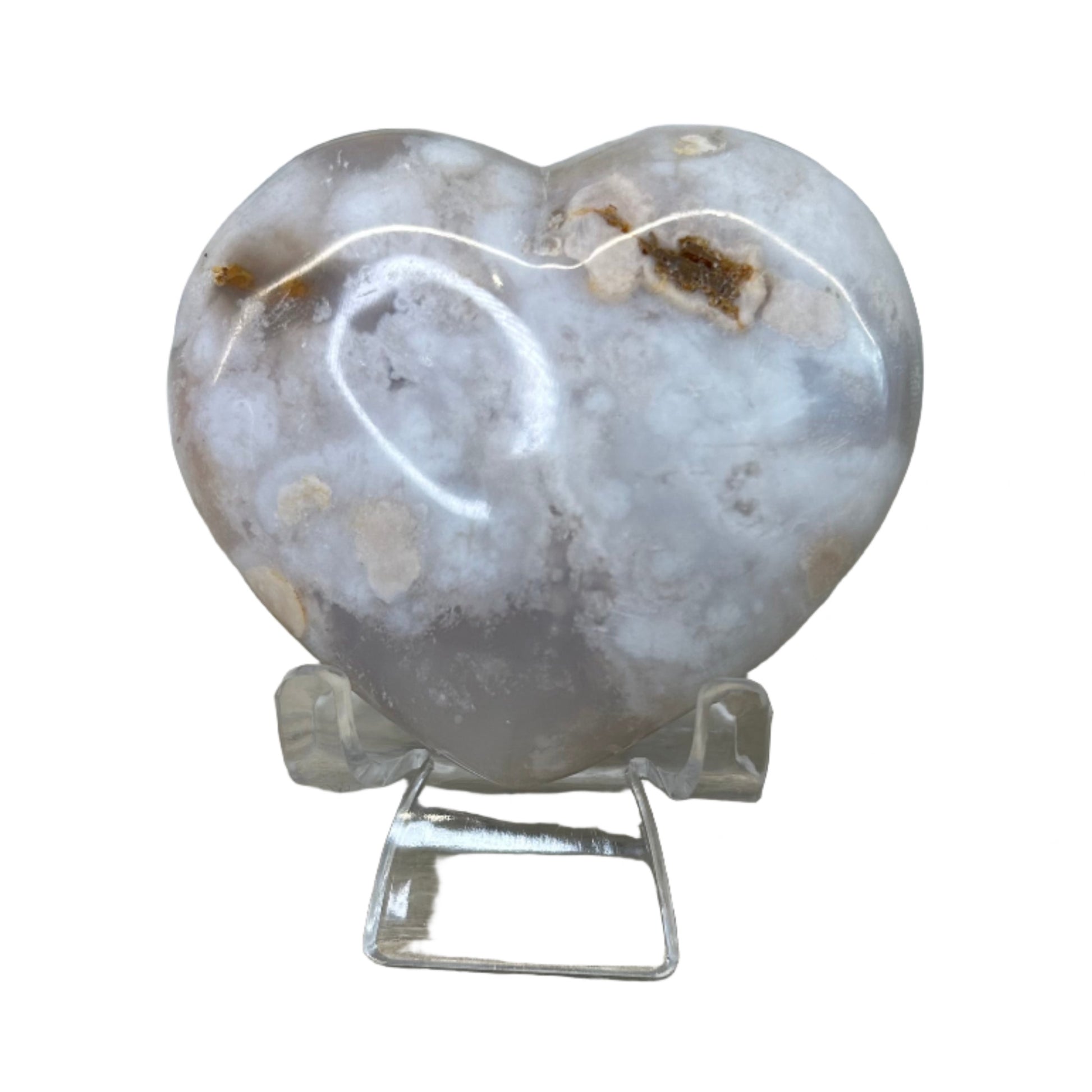 Flower Agate Heart 218g with light pink hues on a stand, promoting relaxation and healing properties.