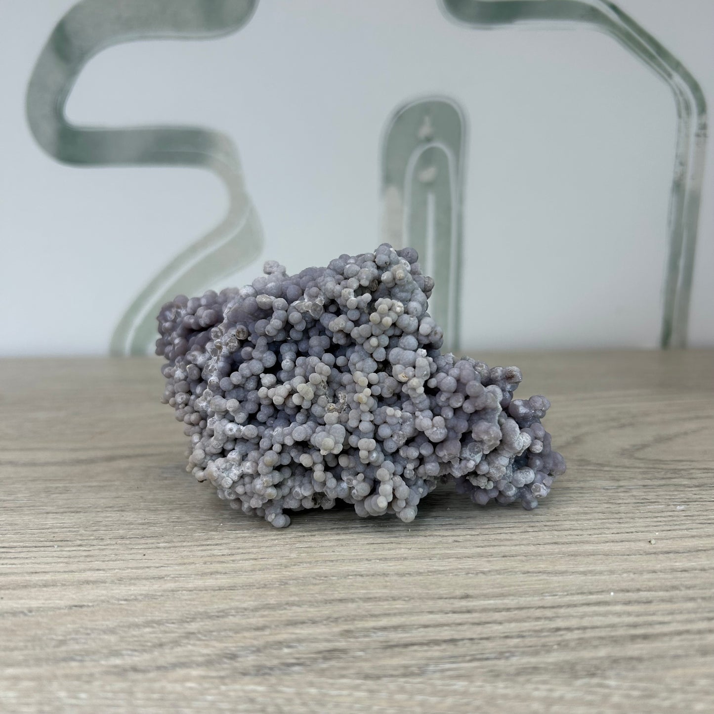 Grape Agate Free Form crystal on a wooden surface, ideal for meditation and stress relief, weighing approximately 320g.