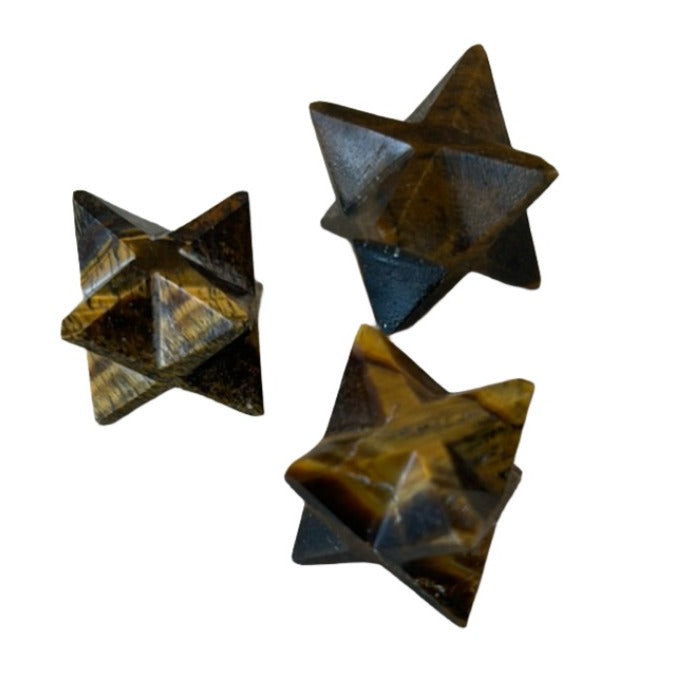 Three Tiger Eye Merkaba mini sculptures showcasing iridescent gold and bronze colors for grounding and protection.