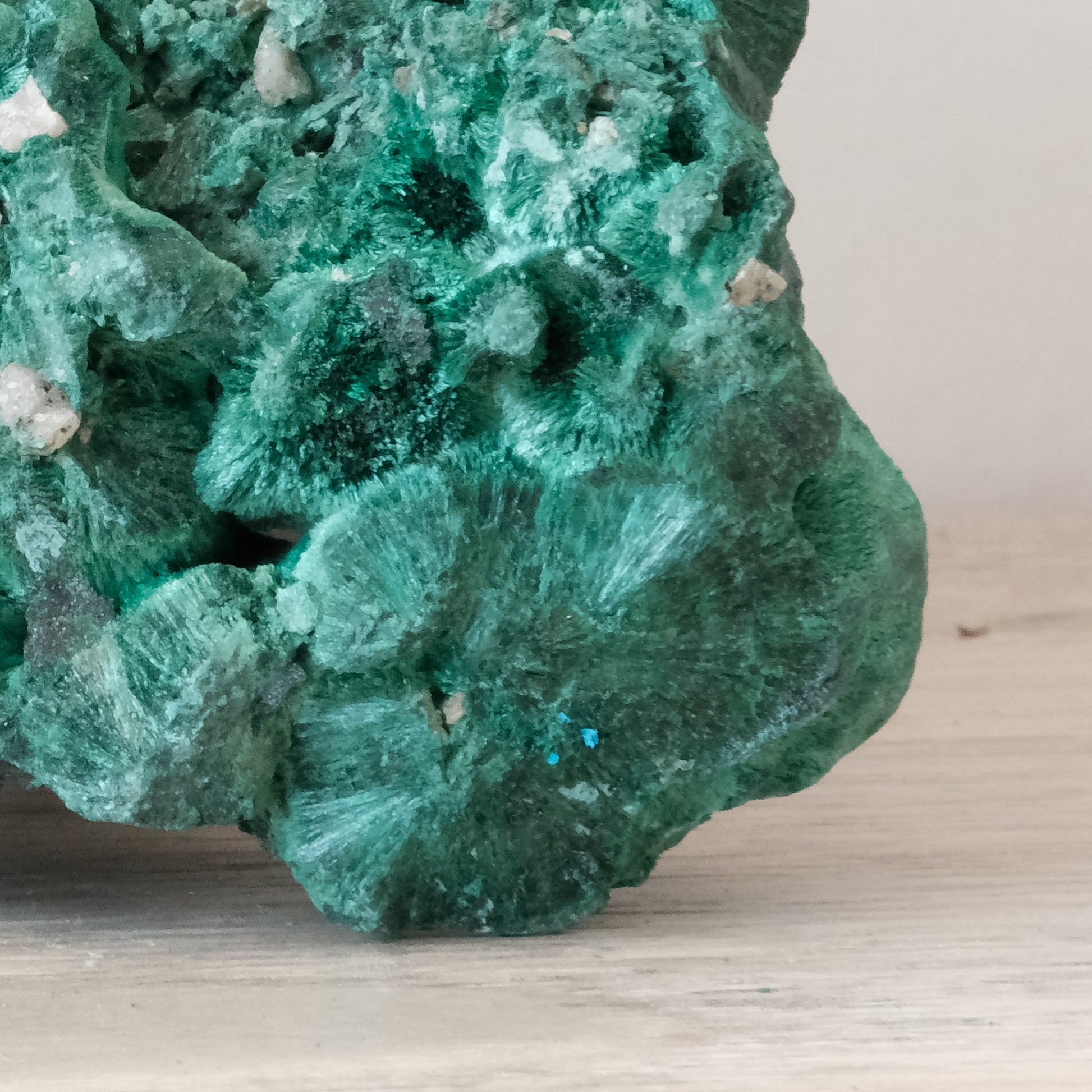 Malachite natural raw form gemstone with textured vibrant green surface, weighing 368g, believed to have healing properties.