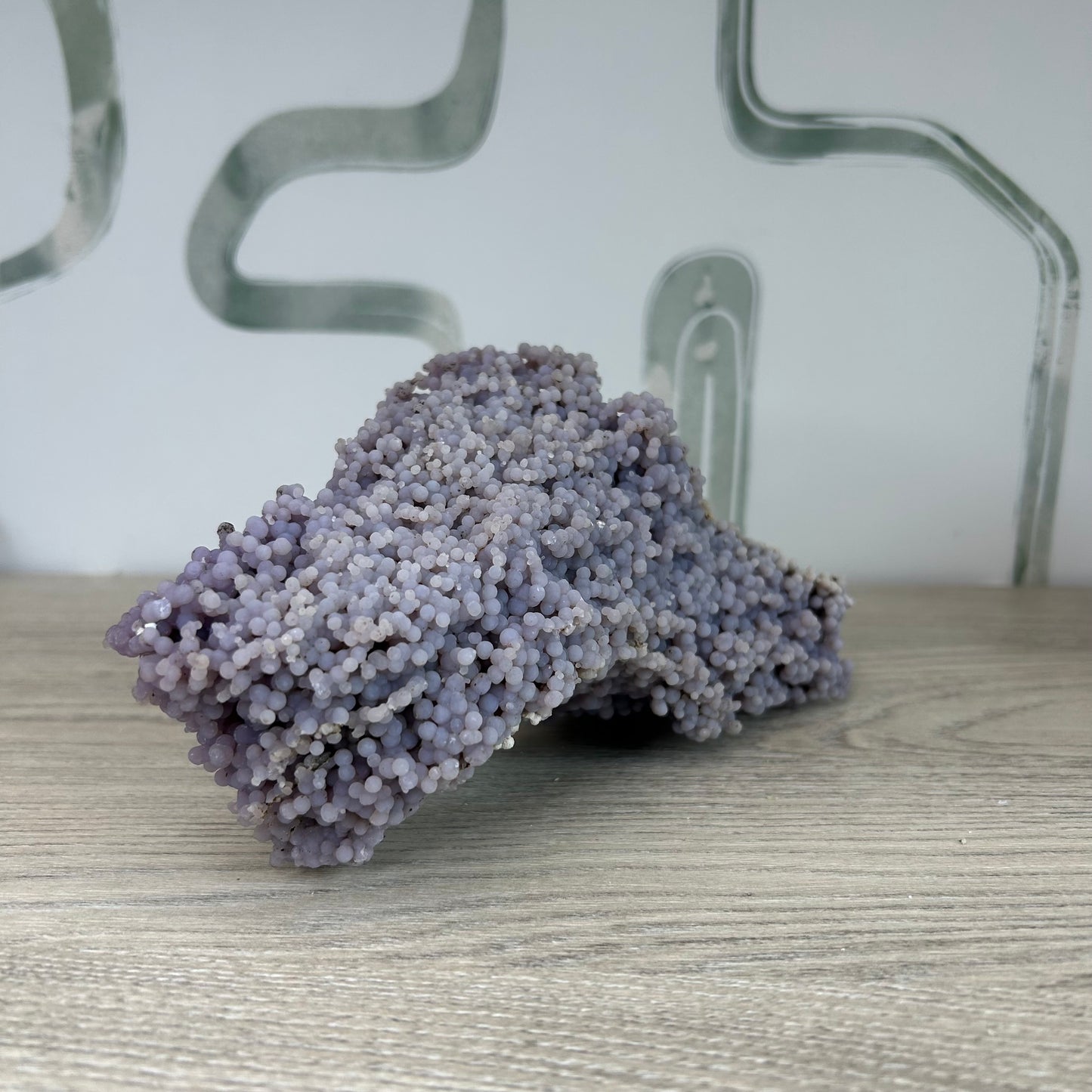 Grape Agate Free Form crystal for meditation, 1019g, promoting inner strength and stress relief, displayed on a wooden surface.