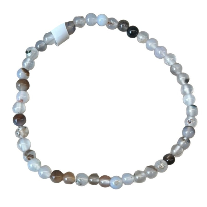 Black and white agate bracelet with 4mm beads, promoting balance and harmony, cleanses aura, and supports healing and wellbeing.