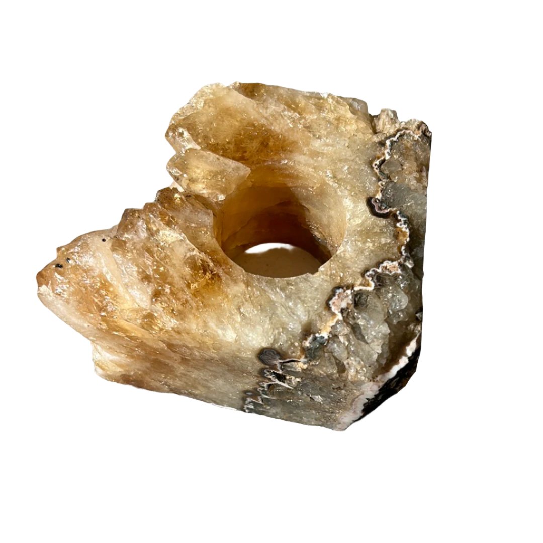 Citrine druze tealight candle holder with raw edges, promoting positivity and wealth in home decor.