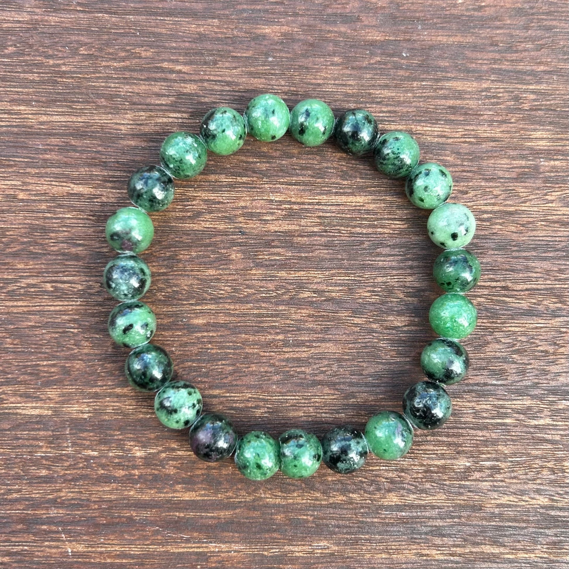 8mm ruby zoisite bracelet showcasing vibrant green and red crystals, perfect for adding sophistication to any outfit.