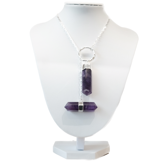 Amethyst Point Necklace on display bust, features double gemstone points promoting stress relief and spiritual clarity.