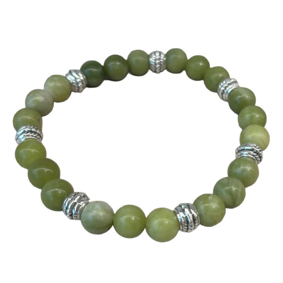 Green gemstone bracelet with silver accent beads, designed for success and positivity.