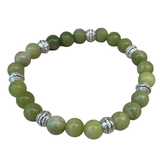 Green gemstone bracelet with silver accent beads, designed for success and positivity.
