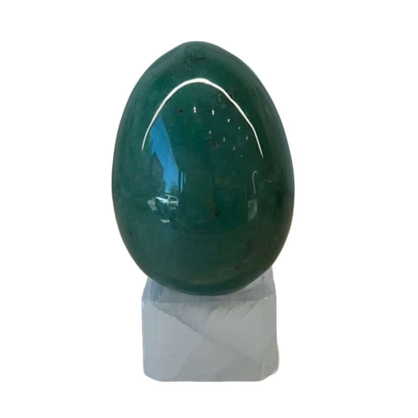 Green Aventurine egg on a white base, promoting harmony, emotional healing, and energetic balance.