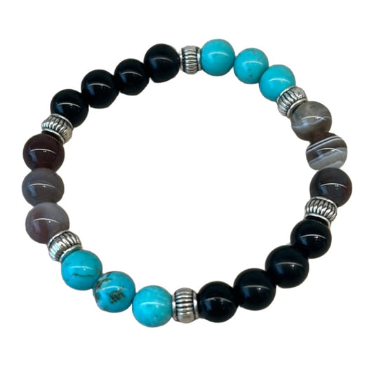 Beaded bracelet with turquoise and black stones for protection from the evil eye.