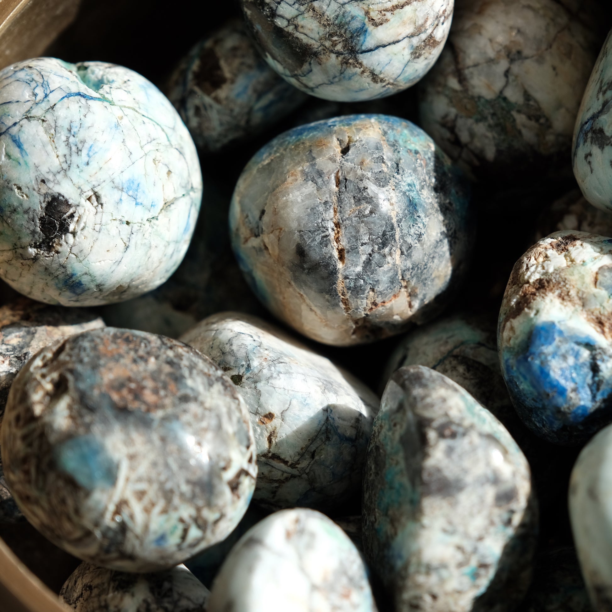 Polished Azurite tumbled stones with striking blue hues for mental clarity and emotional balance.