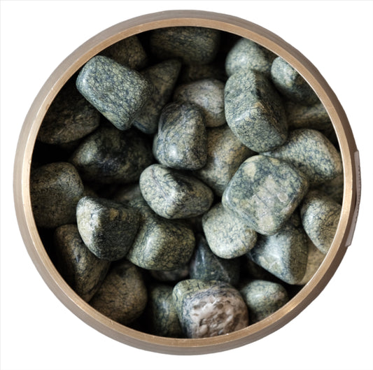 Serpentine tumbled stones in a bowl for meditation and healing energy balance