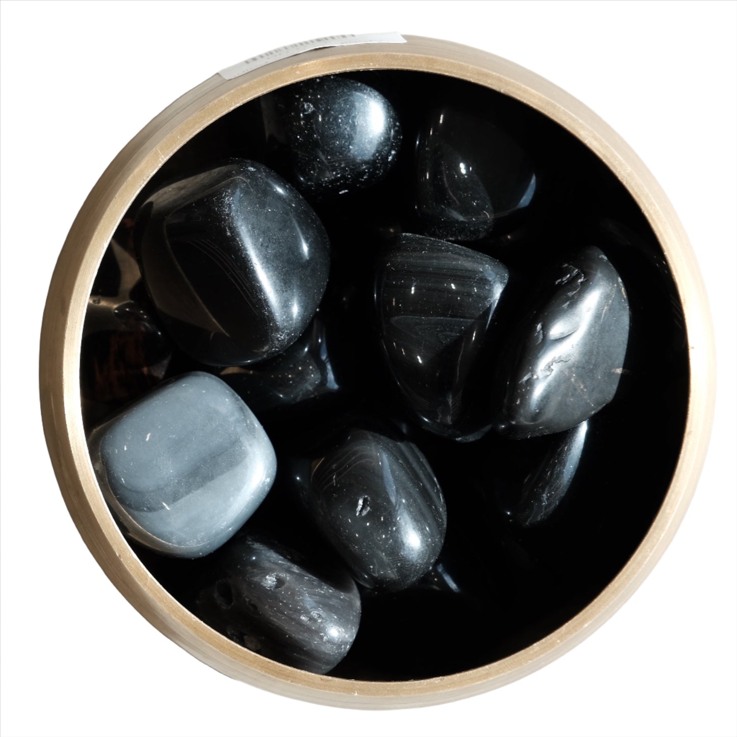 Rainbow Obsidian tumbled stones in a bamboo bowl, showcasing their smooth texture and shimmering colors.
