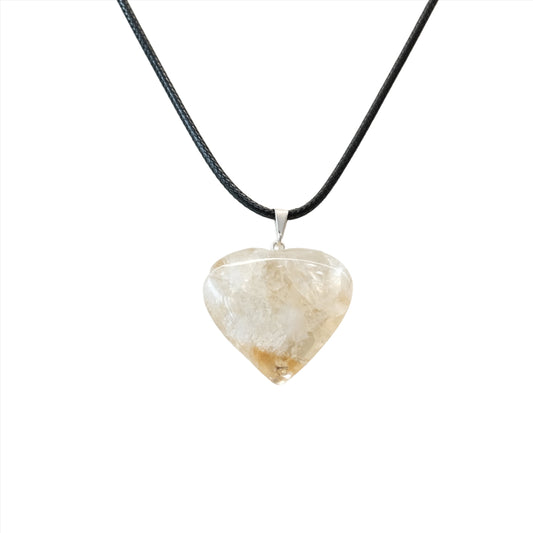 Citrine heart pendant necklace on a black cord, symbolizing energy, wealth, and self-confidence.