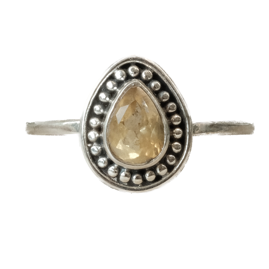 Citrine teardrop ring in sterling silver, size 9, showcasing energizing crystal properties and elegant design.