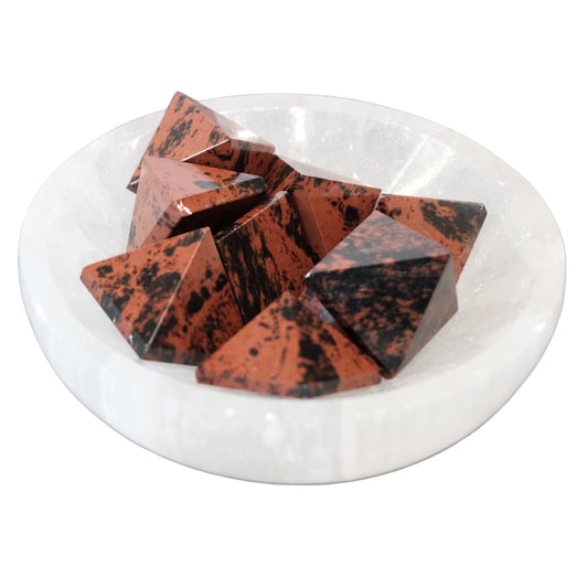 Mahogany obsidian mini pyramids displayed in a white bowl, promoting healing and balance in your space.