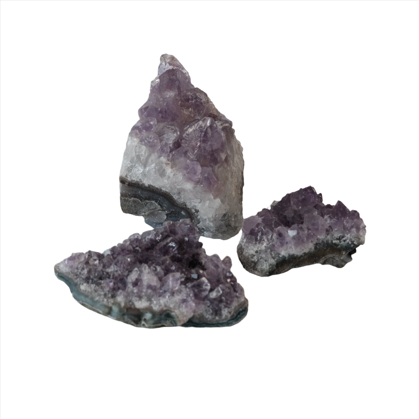 Amethyst cluster healing crystals from Uruguay, purple and green hues, known for stress relief and enhancing clarity and spirituality.
