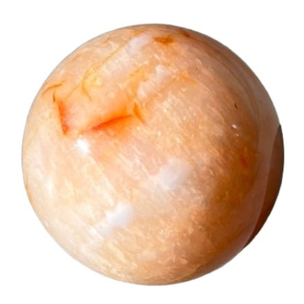 Carnelian sphere 256g promoting vitality, creativity, and positive life choices while aiding physical healing.