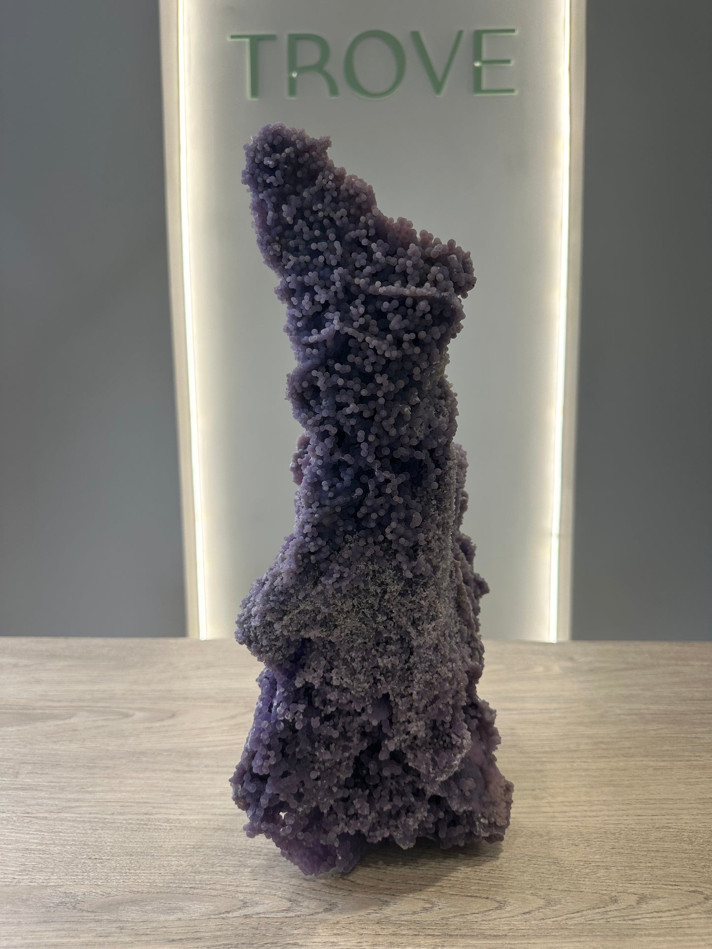 Grape Agate Free Form crystal on display, known for healing properties, enhancing inner strength, and aiding stress relief. Approx 1019g.