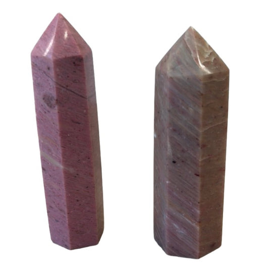 Two Rhodonite towers, showcasing their pink hues and polished surfaces, promoting emotional balance and healing energy.