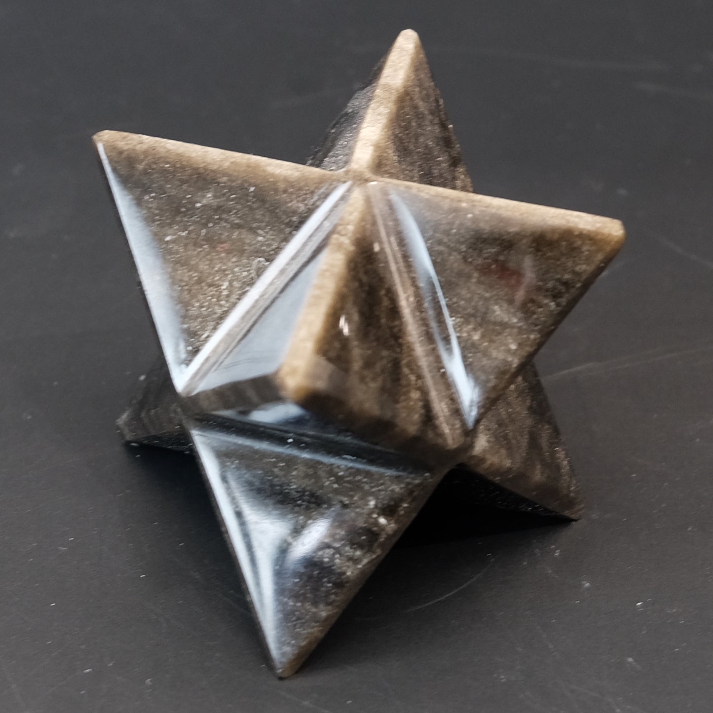 Golden Sheen Obsidian Merkaba, geometric star shape with reflective surface, ideal for meditation and energy work.