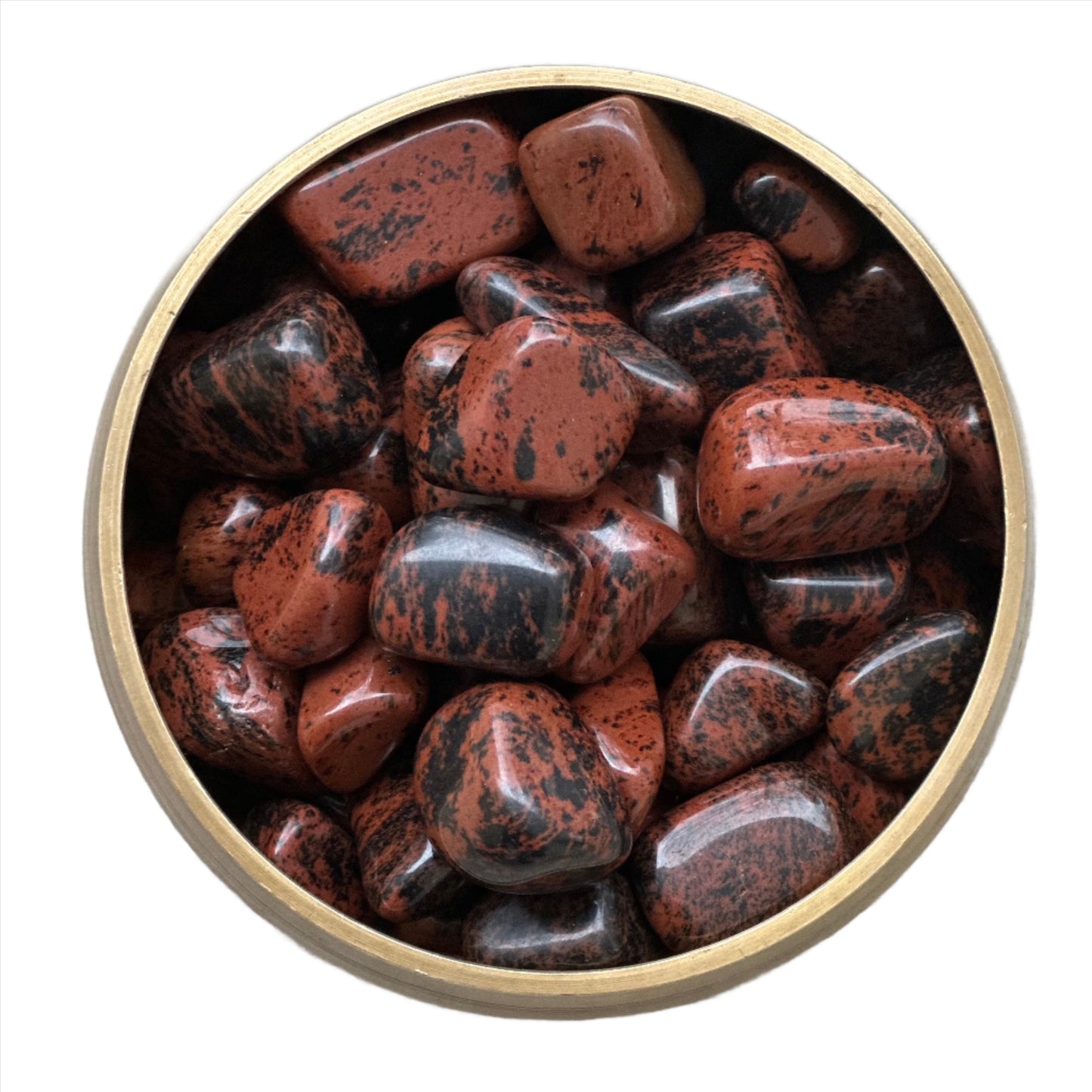 Mahogany Obsidian tumbled stones (10-20MM) in a round gold container, showcasing their rich earthy colors and smooth textures.