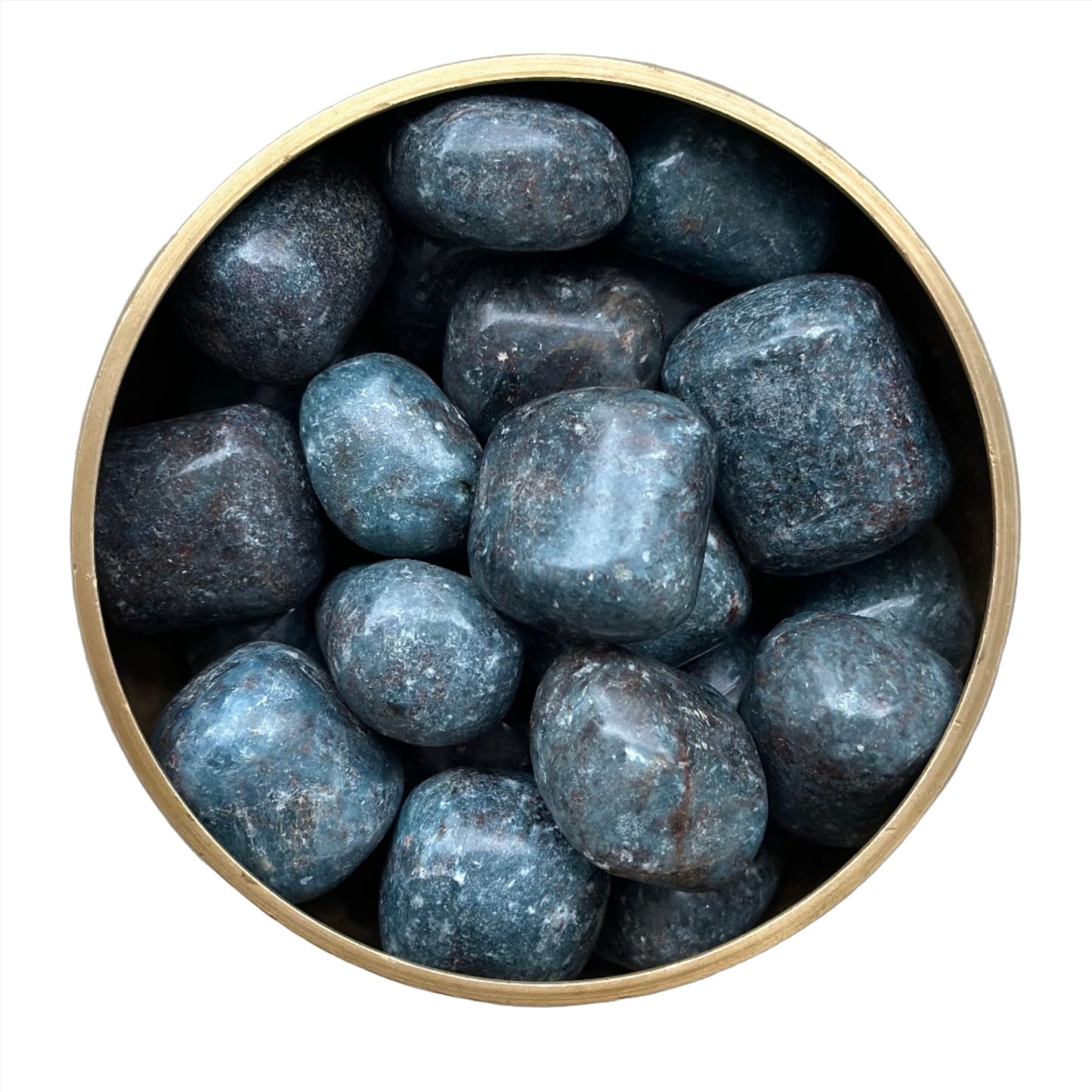 Kyanite tumbled stones in a bowl, known for healing properties and chakra alignment, enhancing communication and spiritual growth.
