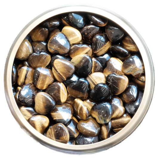 Bowl of Tiger Eye Heart stones with iridescent gold and bronze hues, symbolizing grounding and protection energy.