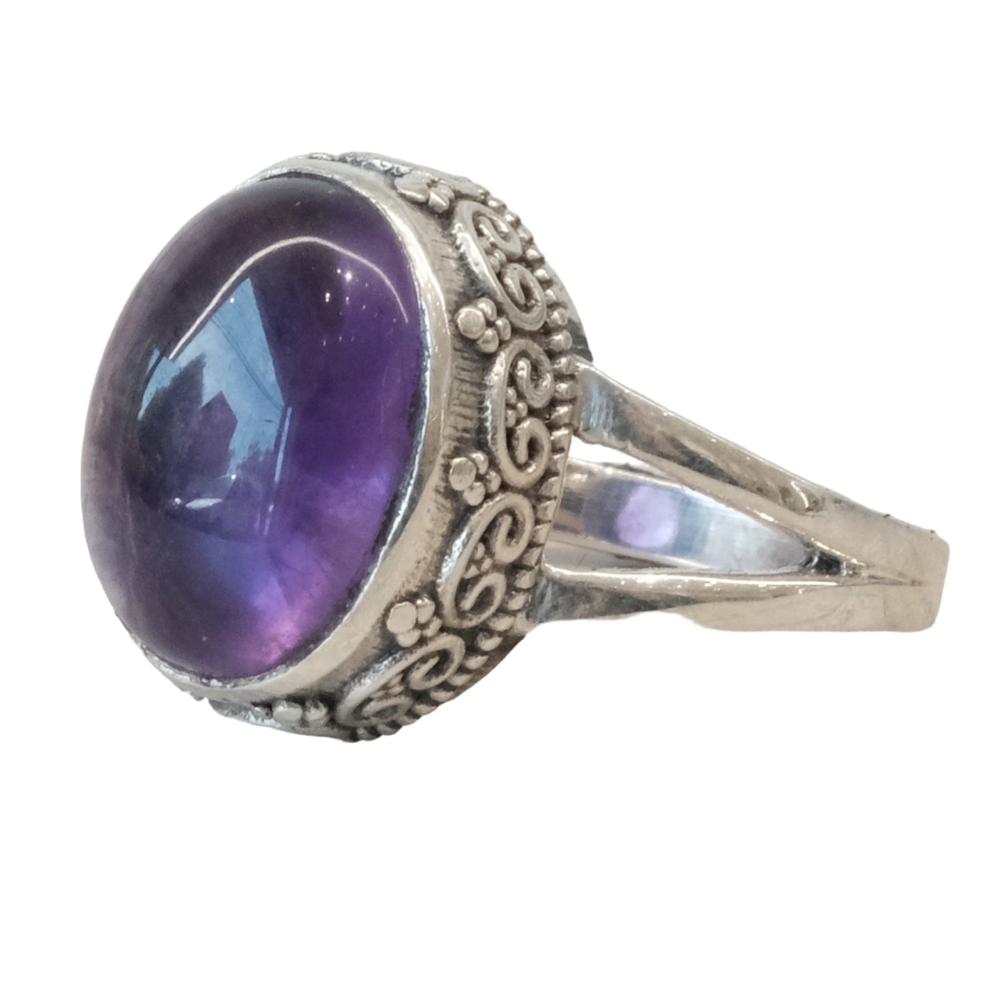 Sterling silver ring with an oval amethyst stone, featuring intricate floral engravings, size 7.
