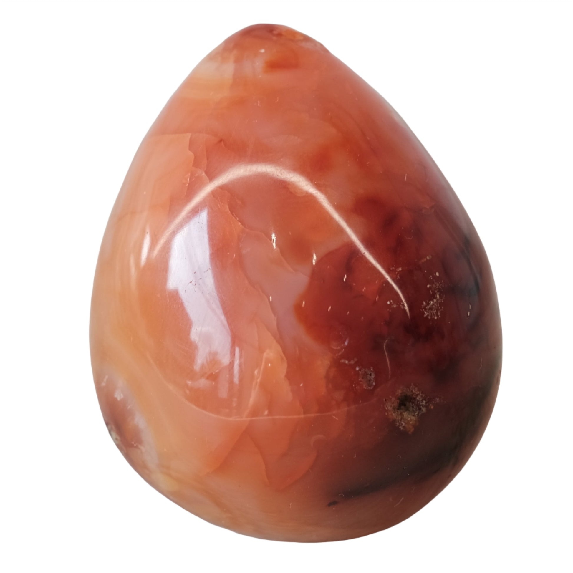 Carnelian egg to enhance vitality, creativity, and promote positive choices while supporting physical healing.