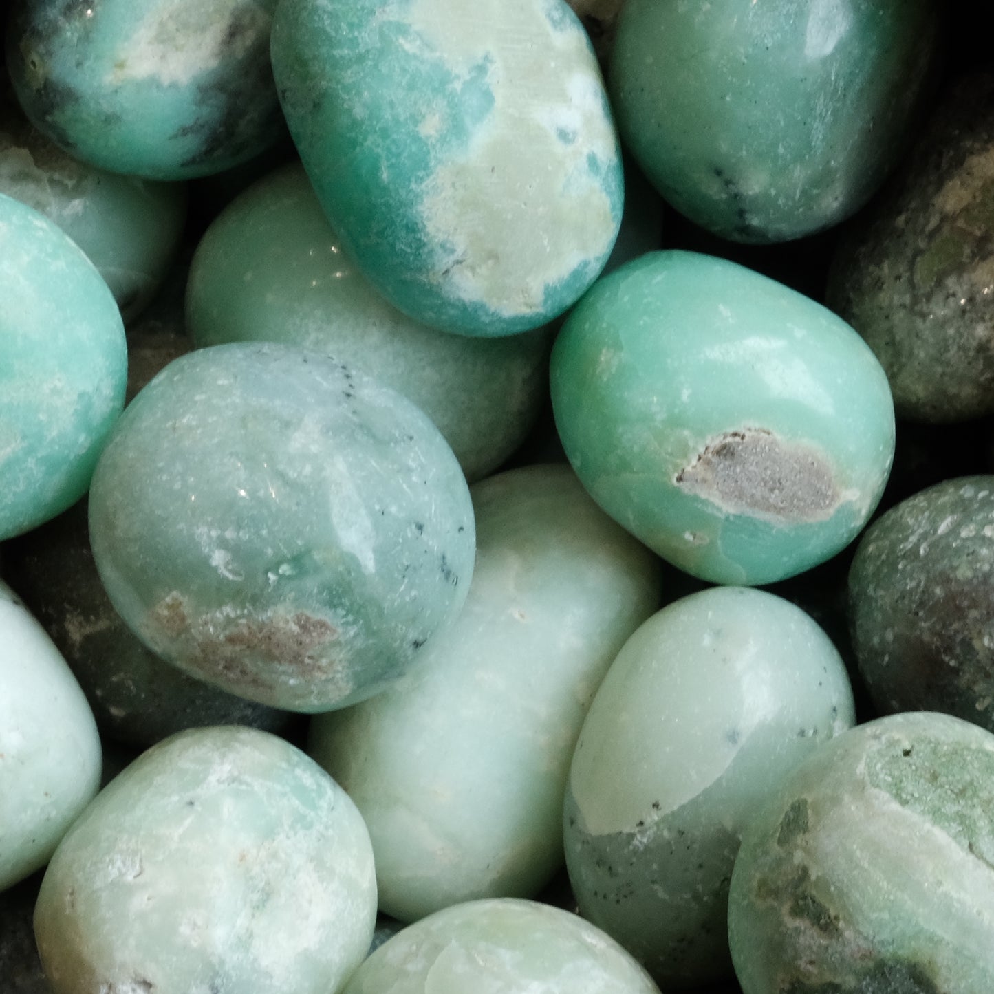 Tumbled chrysoprase stones promoting creativity, love, and hope