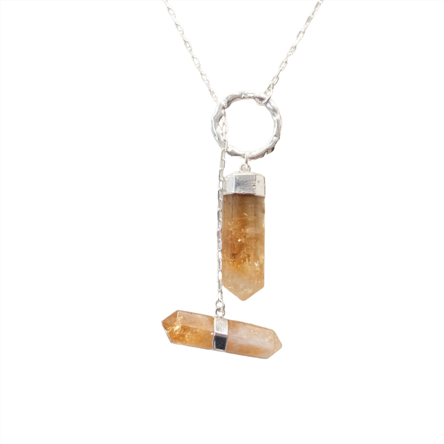 Citrine double point necklace featuring two vibrant crystals in a silver setting, symbolizing energy and prosperity.