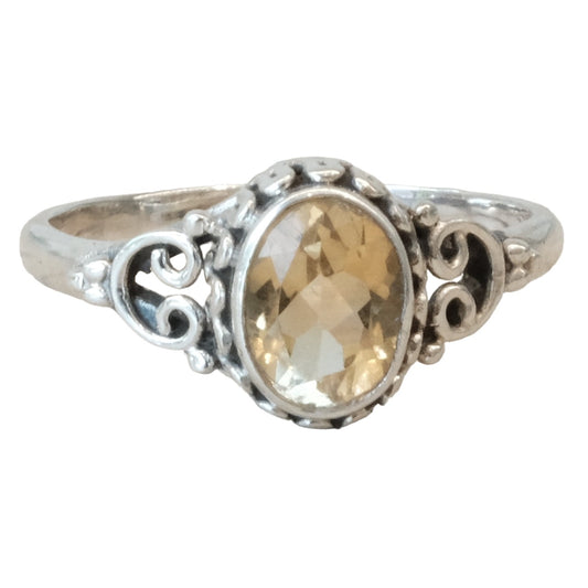 Citrine sterling silver ring size 9 featuring an oval-shaped citrine gemstone in an ornate setting.