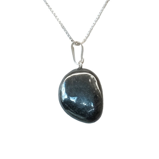 Hematite tumble stone pendant on a silver chain, offering grounding, courage, and increased focus.