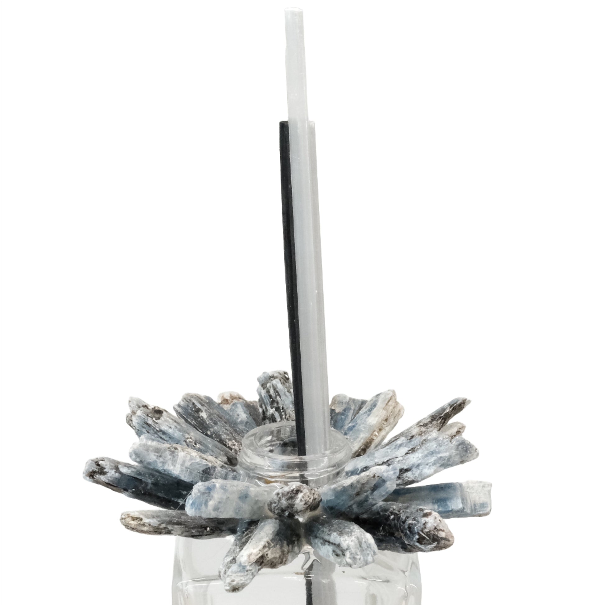 Kyanite diffuser with blue crystal design and reed sticks in a glass container for aromatherapy.