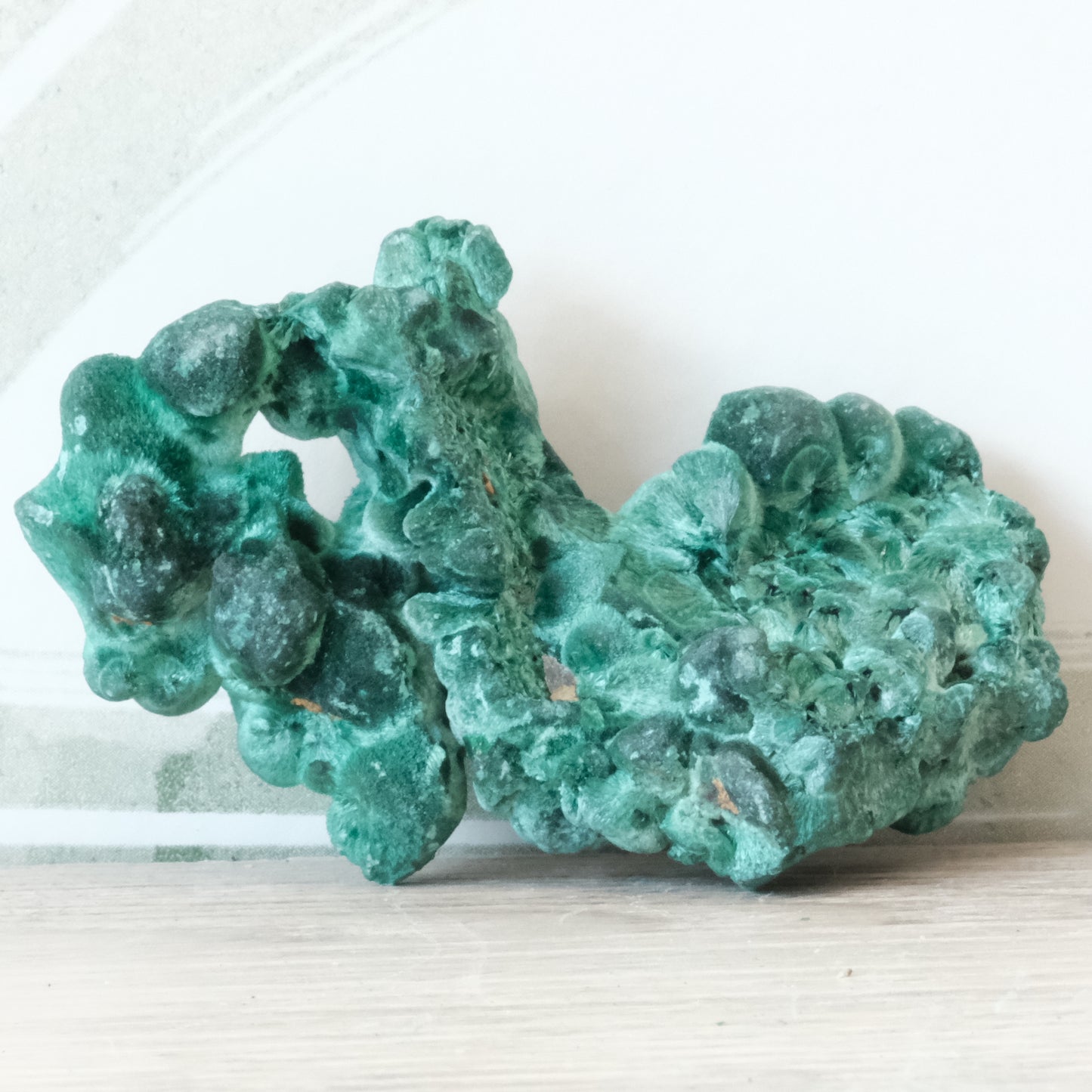 Raw 70g Malachite gemstone showcasing vibrant green color and natural form, known for healing and detoxifying properties.