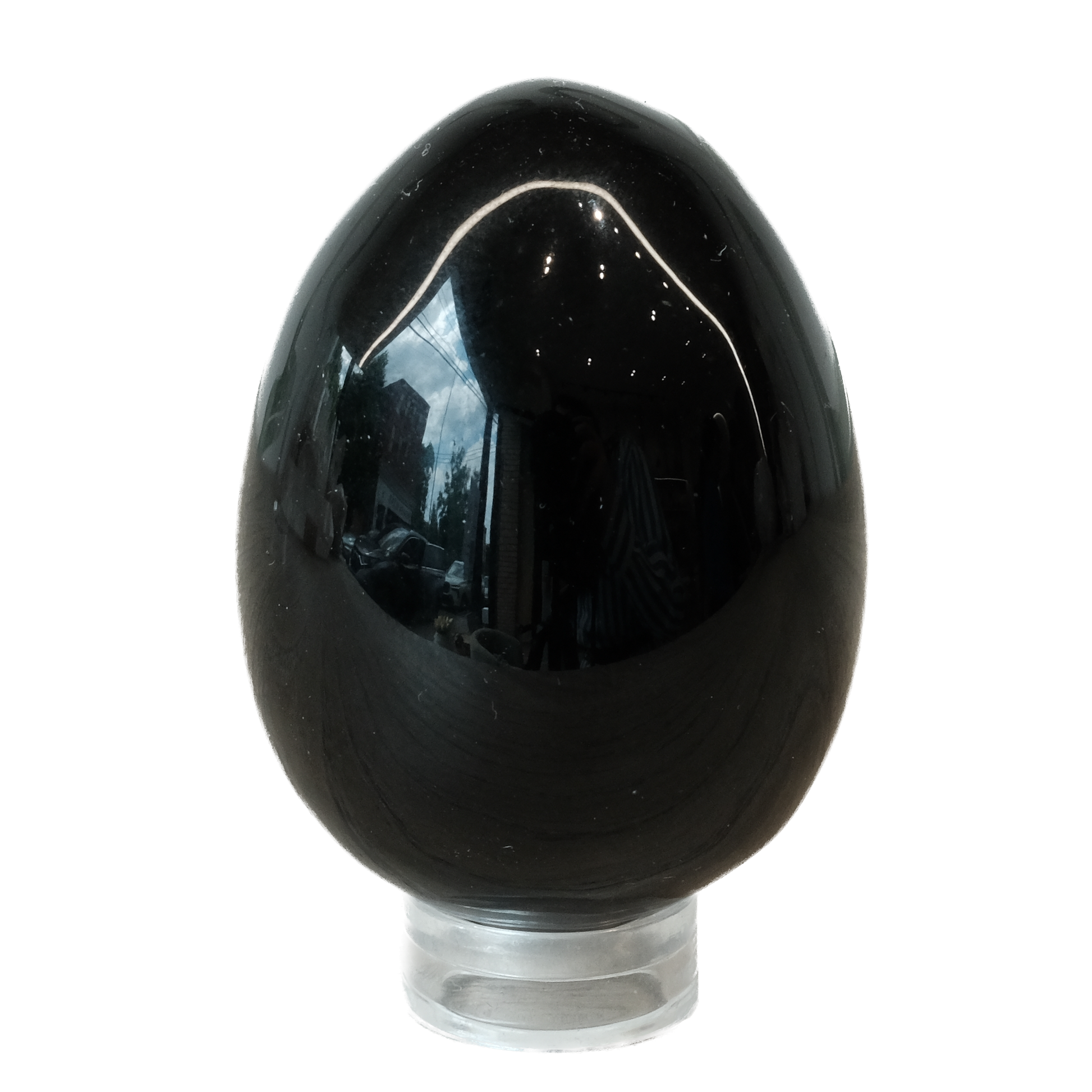 Glossy black obsidian egg on a clear stand, known for protection against negativity and enhancing self-discovery.