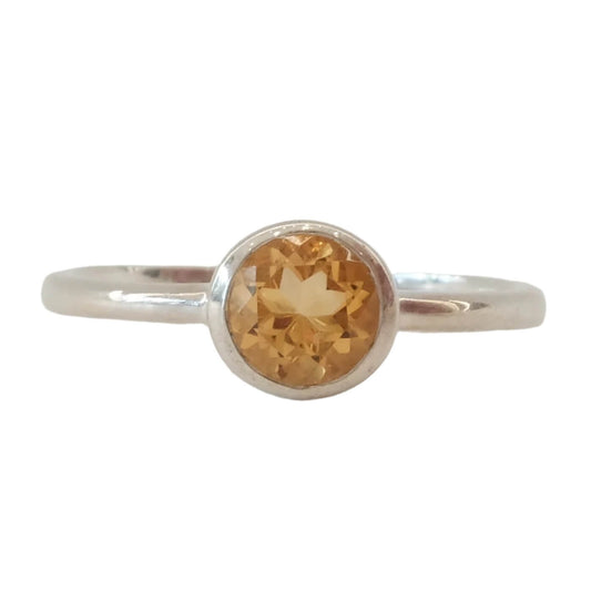 Citrine round sterling silver ring size 6, known for energizing life, enhancing intuition, and attracting wealth and success.