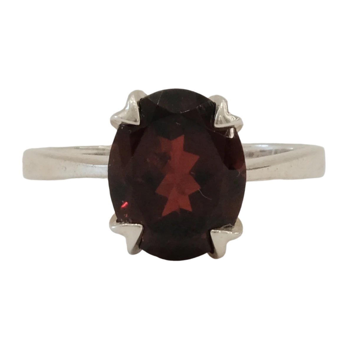 Garnet sterling silver ring size 5 with a deep red oval gemstone, offering healing and protective properties against negative energies.
