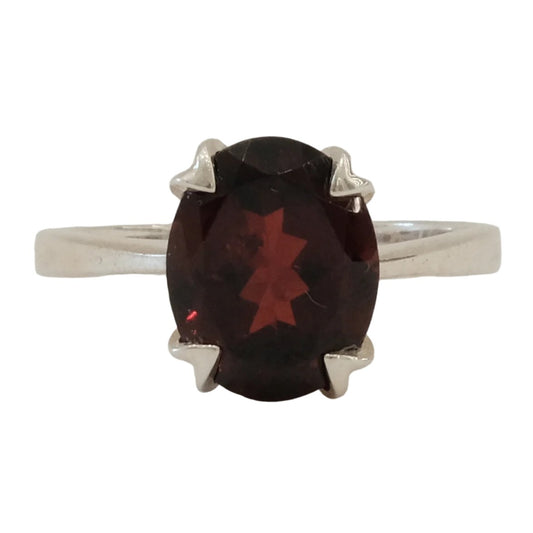 Garnet sterling silver ring size 5 with a deep red oval gemstone, offering healing and protective properties against negative energies.