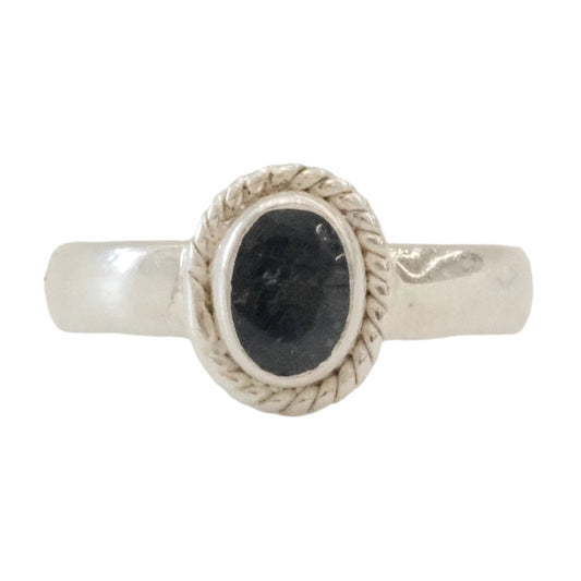 Oval blue sapphire ring in sterling silver, size 8, symbolizing wisdom and serenity.