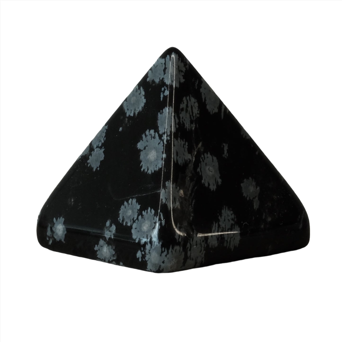 Snowflake Obsidian pyramid showcasing its unique black and white speckled pattern for meditation and healing.