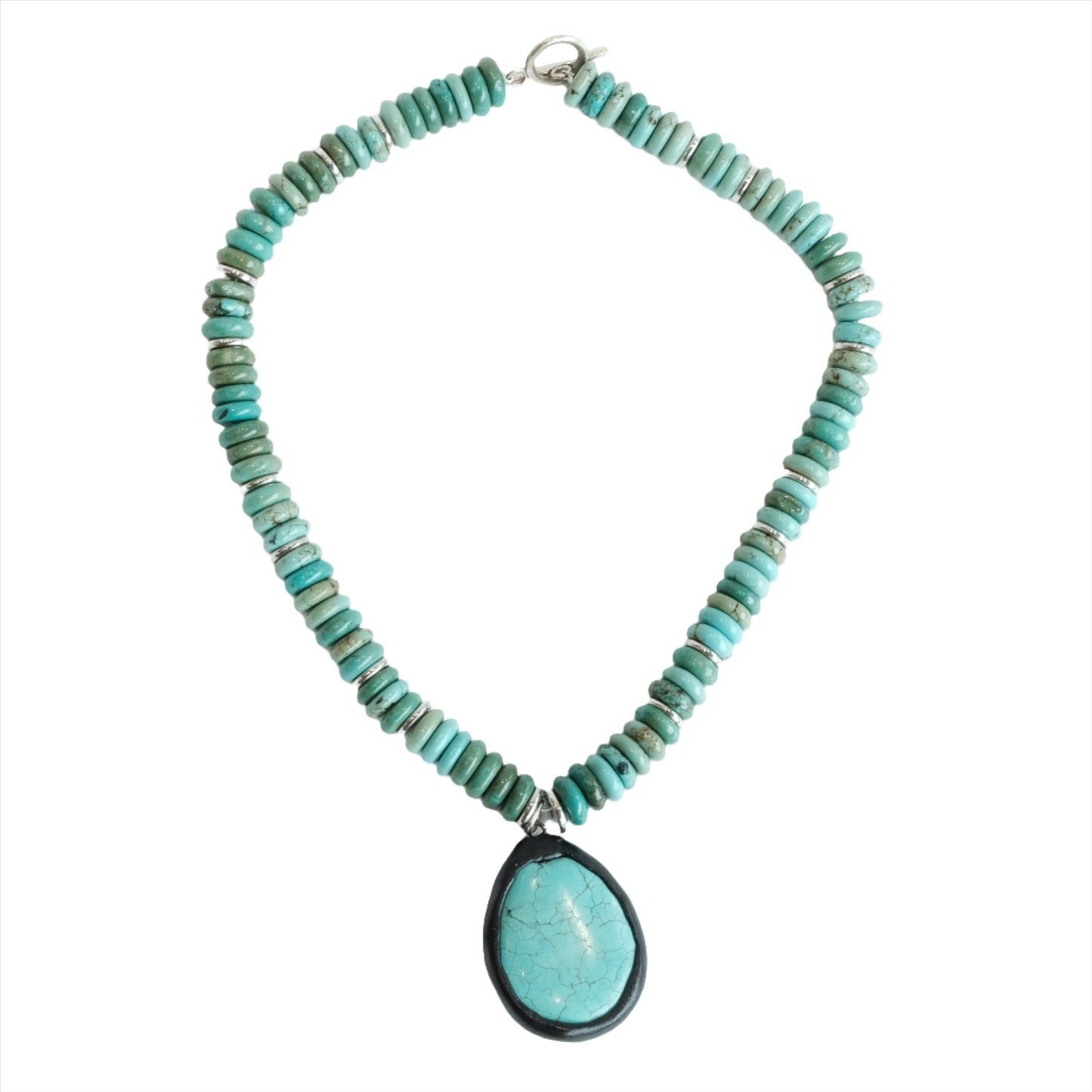 Elegant turquoise necklace with a vibrant turquoise drop pendant.