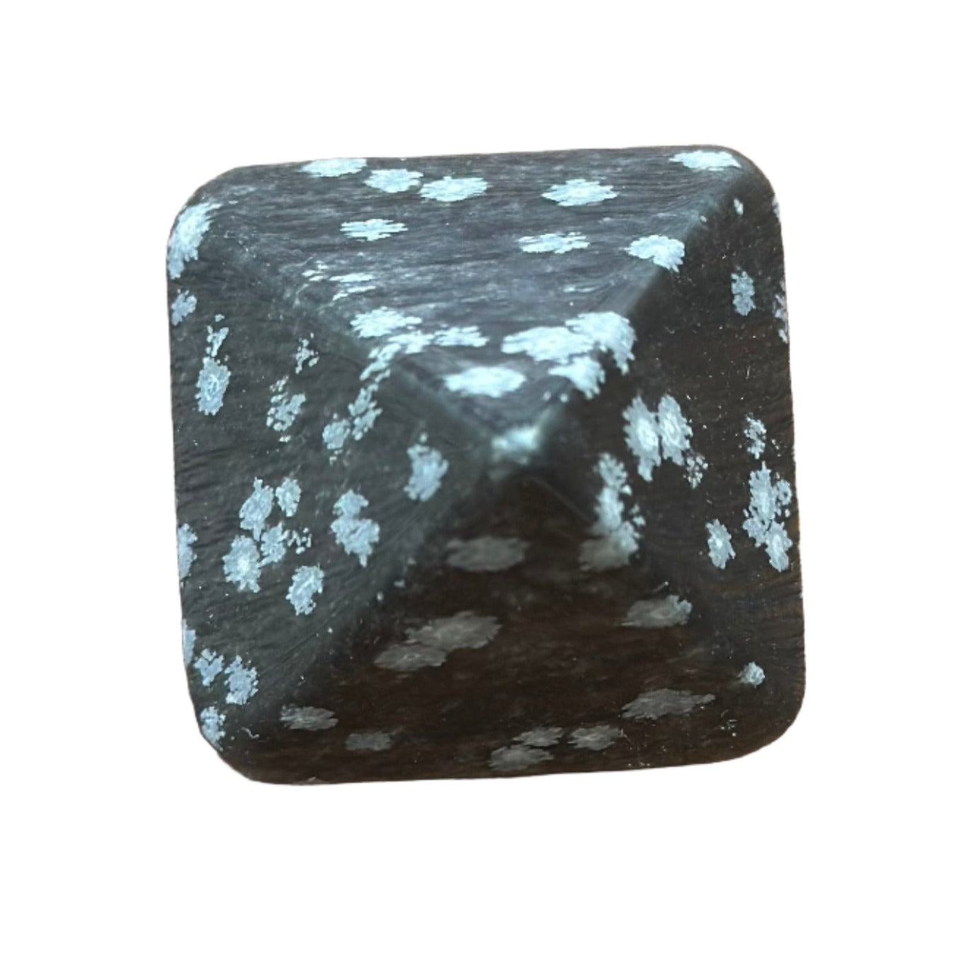 Snowflake Obsidian pyramid promoting calm and healing, ideal for meditation and releasing negative thoughts.