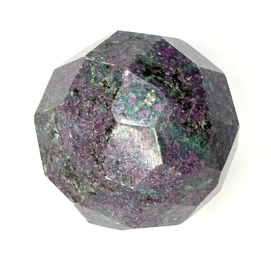 Ruby Kyanite faceted sphere showcasing vibrant colors and unique natural patterns, symbolizing energy and prosperity.