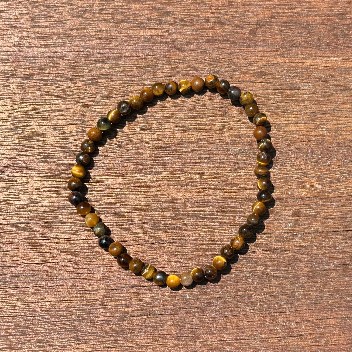 Tiger Eye Bracelet 4mm, promotes focus, protects, enhances willpower, and supports emotional well-being.