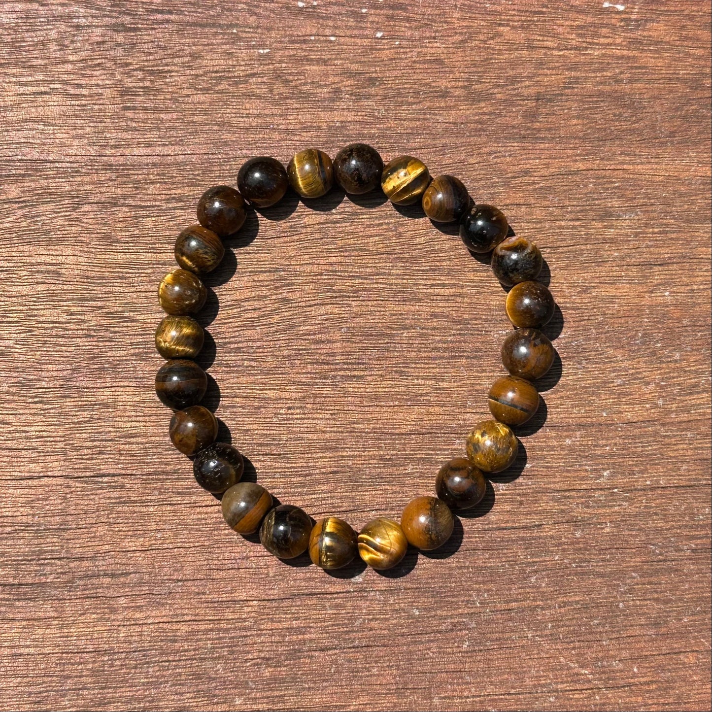 Tiger Eye Bracelet 8MM showcasing dark and golden beads for focus, protection, and good luck.