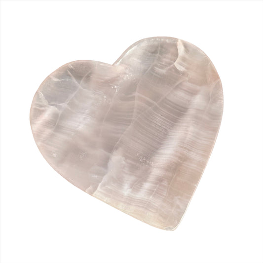 Pink calcite heart-shaped plate, smooth texture, perfect for decor and healing practices. Ideal for crystal enthusiasts.