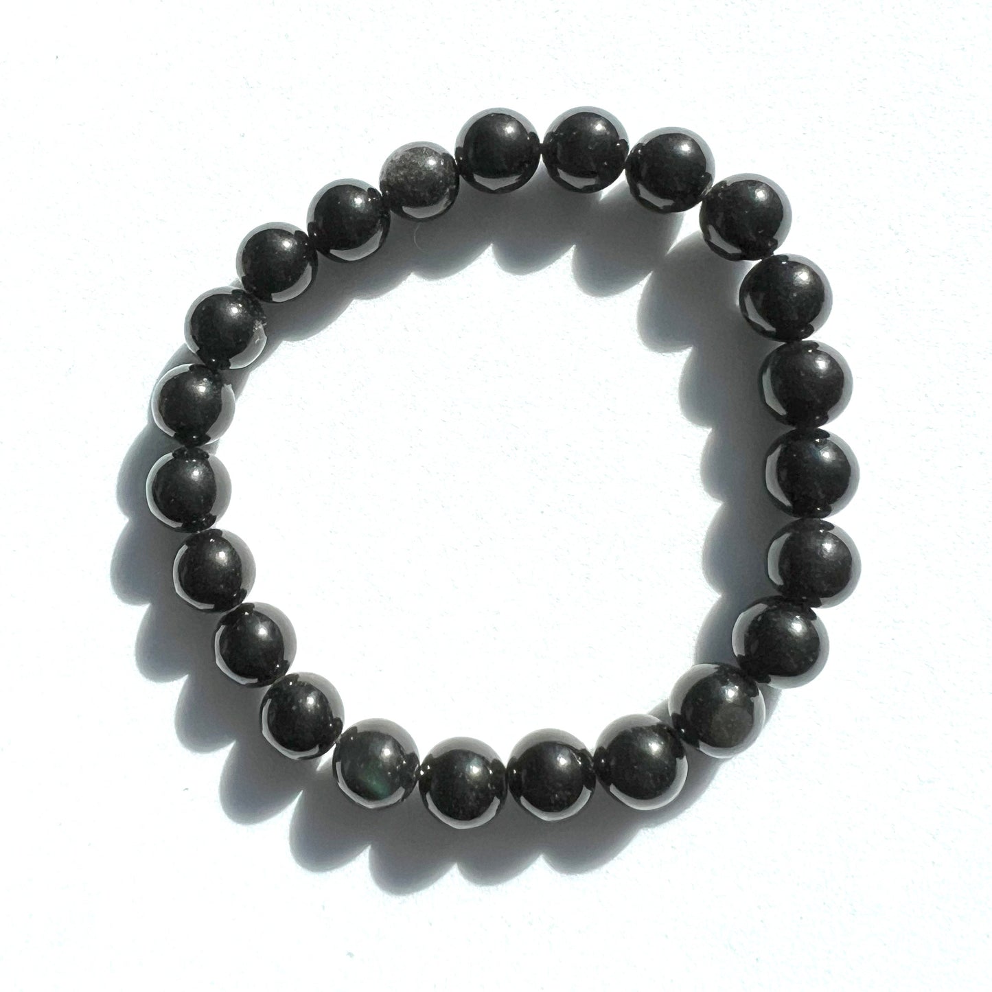 Rainbow Obsidian bracelet with 8mm beads, elegant and stylish accessory for any outfit.